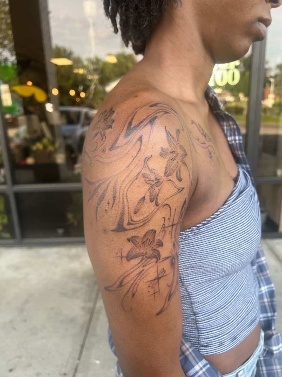 Fine Line + Floral lilies tattoo on Upper Arm by Smokesart on TattMe
