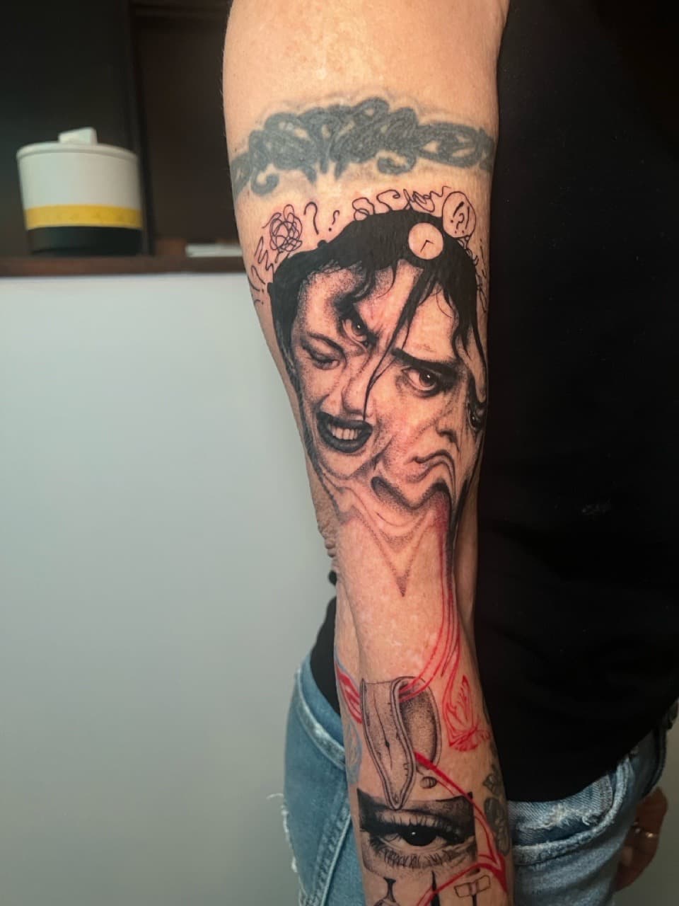 Black & Grey + Surrealism faces tattoo on Half Sleeve by Smokesart on TattMe