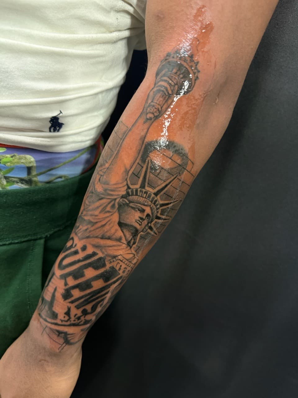 Black & Grey + Lettering statue of liberty tattoo on Forearm by Arink_Tattoo on TattMe