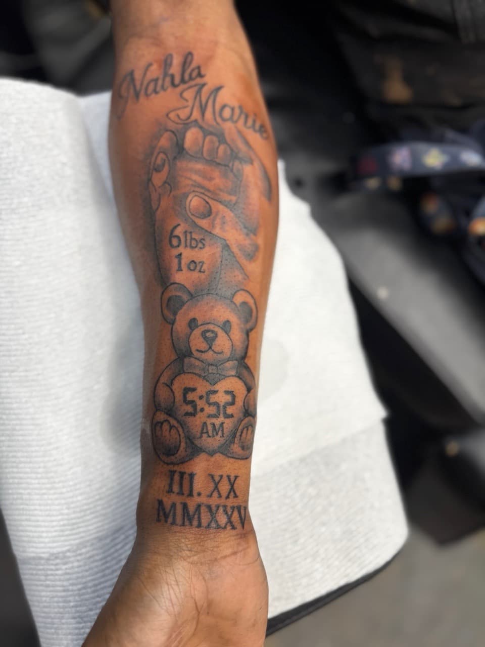 Black & Grey + Lettering baby hand tattoo on Forearm by HoodInkedd843 on TattMe