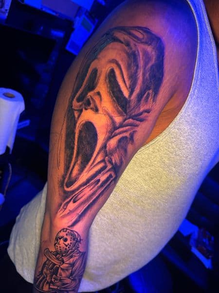 Black & Grey + Illustrative ghostface tattoo on Half Sleeve by HoodInkedd843 on TattMe