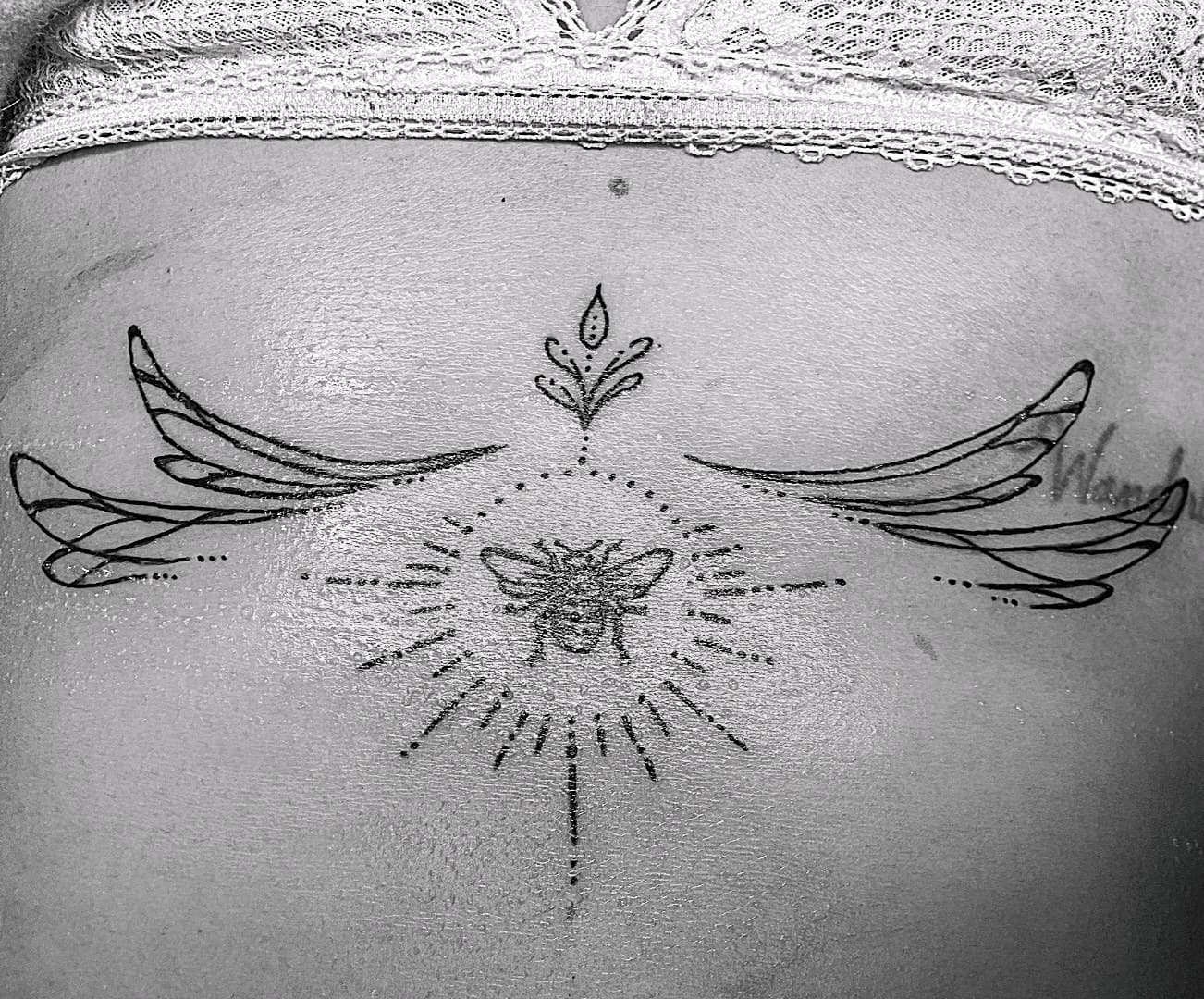 Fine Line + Black-work bee tattoo on Lower Back by Selva_Tierra_Tattoos on TattMe