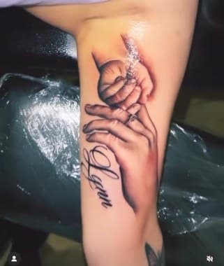 Realism + Black & Grey hands tattoo on Upper Arm by Lo_Mann on TattMe