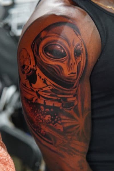 Realism + Illustrative alien tattoo on Upper Arm by Moe_Tatts on TattMe