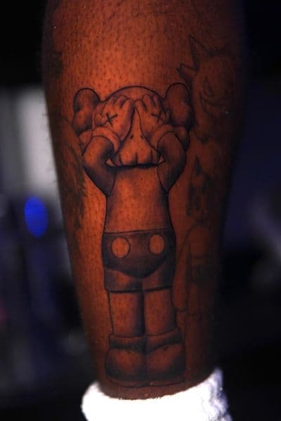 Pop Culture + Black & Grey kaws companion tattoo on Calf by Moe_Tatts on TattMe