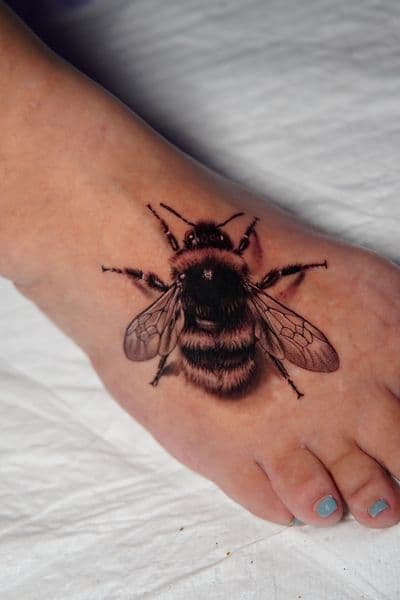 Realism + Black & Grey bumblebee tattoo on Foot by Moe_Tatts on TattMe