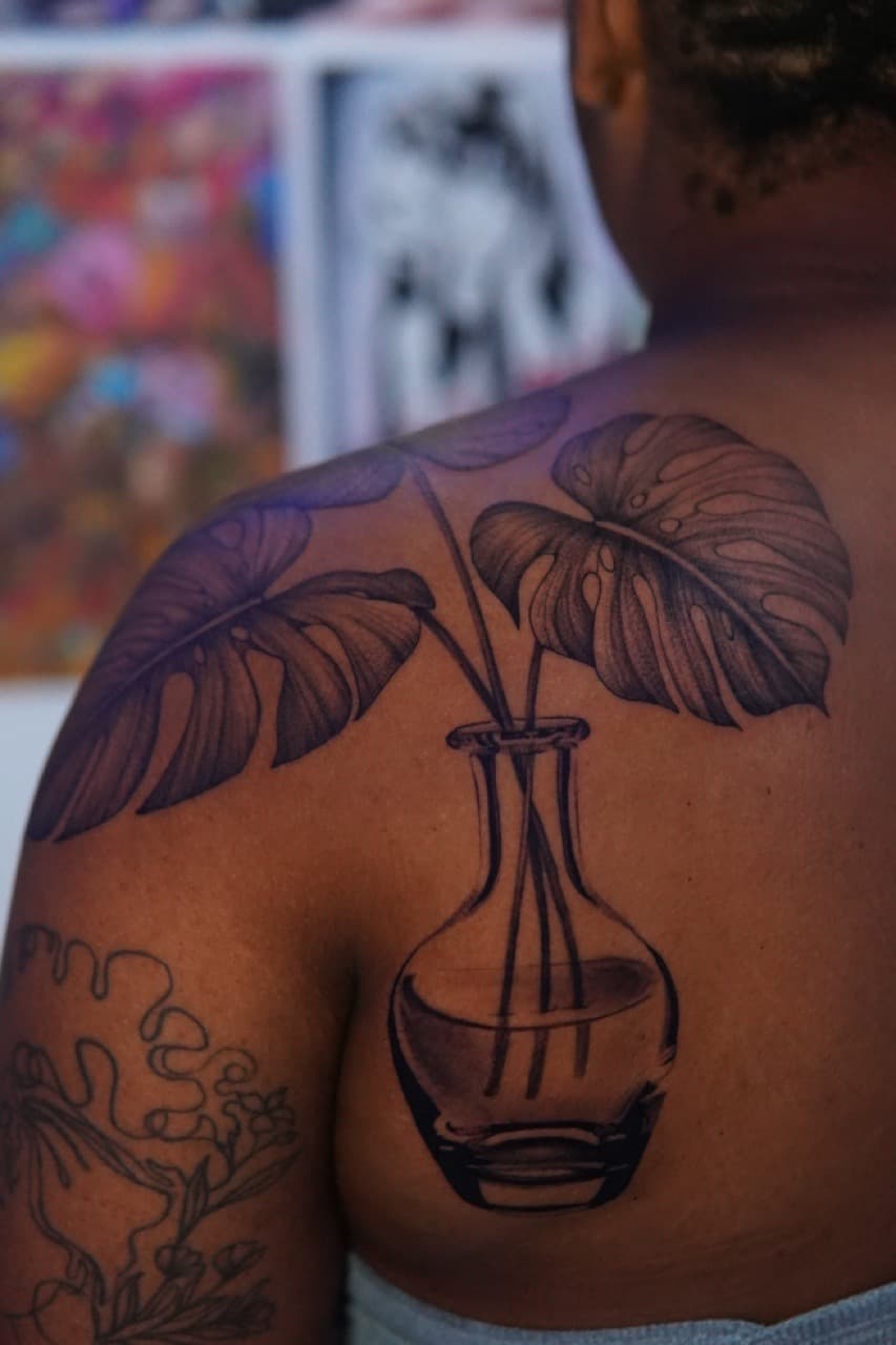 Black & Grey + Illustrative monstera tattoo on Upper Arm by Moe_Tatts on TattMe