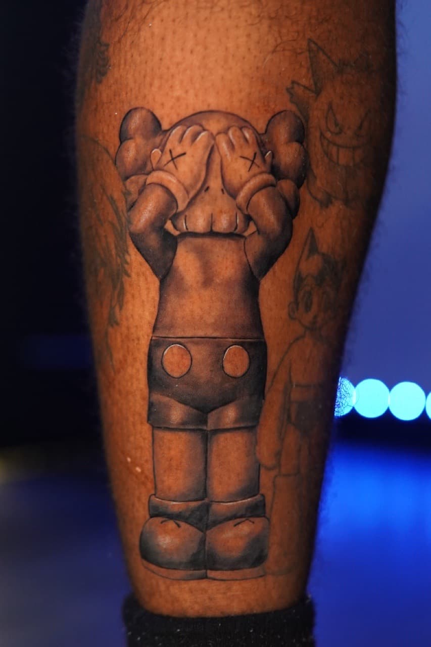 Black & Grey + Pop Culture kaws companion tattoo on Upper Arm by Moe_Tatts on TattMe