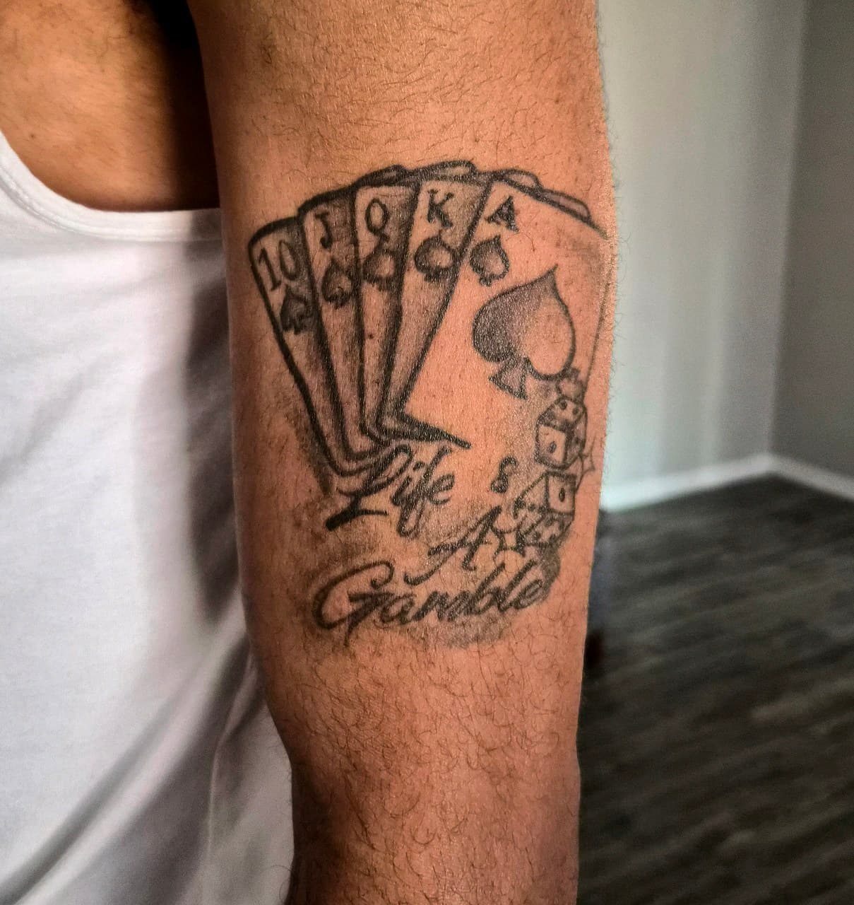 Black & Grey + Lettering cards tattoo on Upper Arm by Cay_Tattoos on TattMe