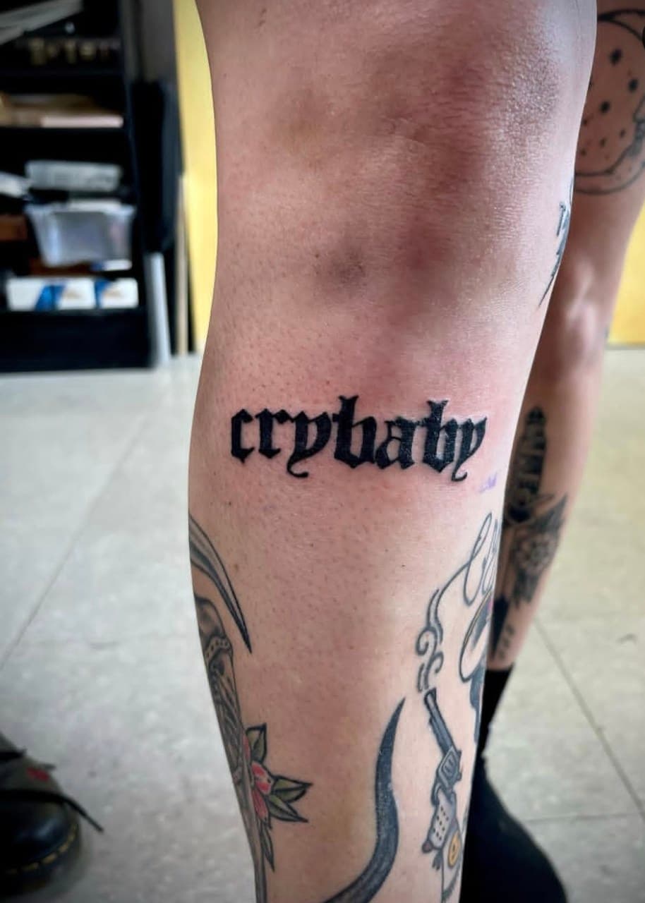 Lettering + Script crybaby tattoo on Knee by Cay_Tattoos on TattMe