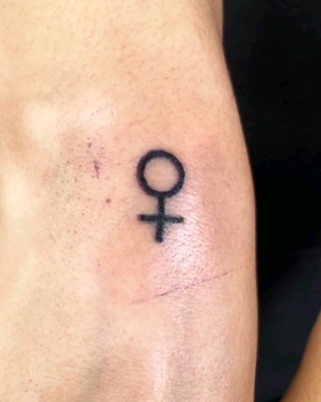 Fine Line + Minimalist female symbol tattoo on Upper Arm by Cay_Tattoos on TattMe