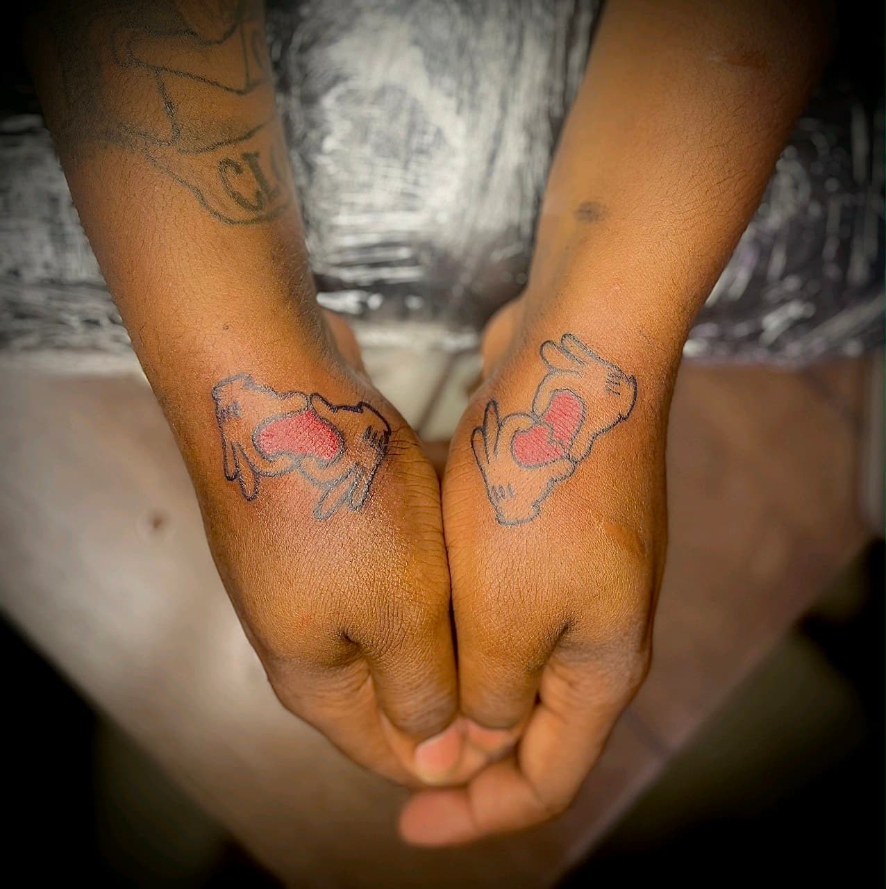 Fine Line + Color hands tattoo on Wrist by Cay_Tattoos on TattMe