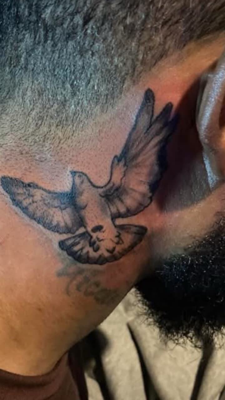 Black & Grey + Illustrative dove tattoo on Behind Ear by VonTattz on TattMe