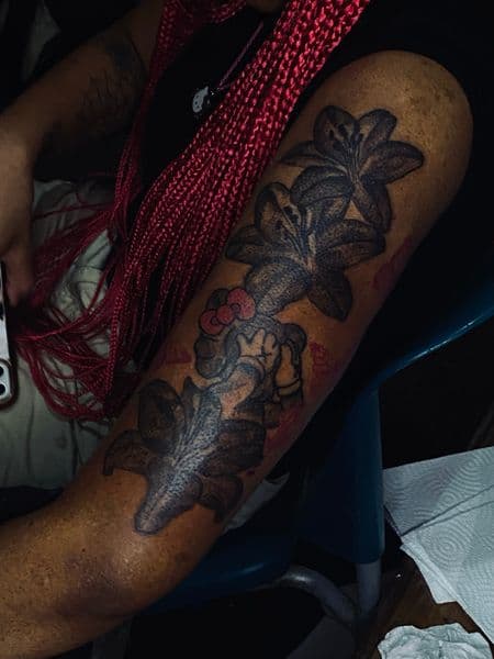 Black & Grey + Illustrative flowers tattoo on Upper Arm by TeezTalent on TattMe