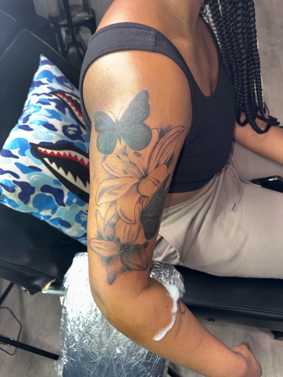 Black & Grey + Floral flowers tattoo on Upper Arm by InkByArtie on TattMe