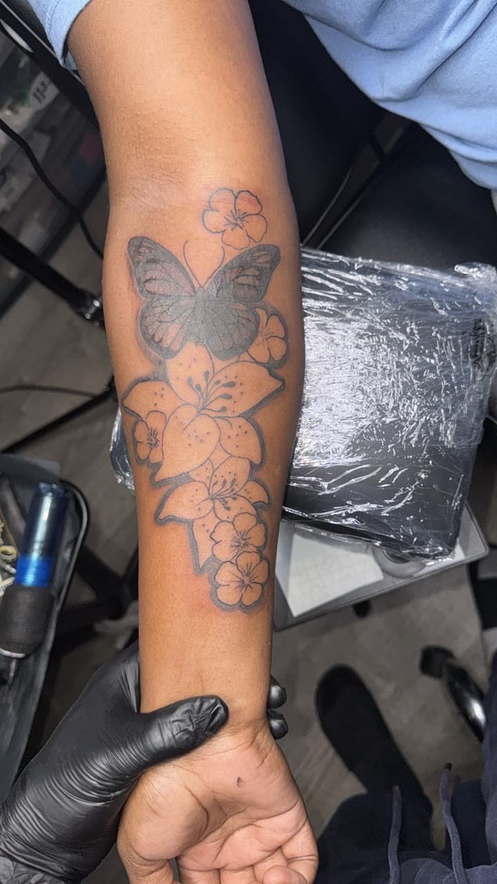 Black & Grey + Floral butterfly tattoo on Forearm by InkByArtie on TattMe