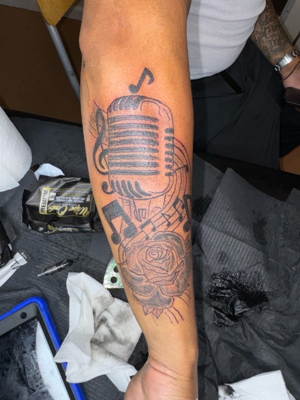 Black & Grey + Illustrative microphone tattoo on Forearm by InkByArtie on TattMe