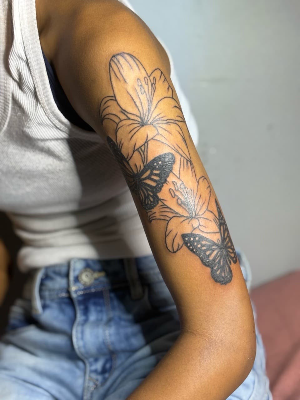 Fine Line + Black-work flowers tattoo on Upper Arm by Inkbyzaza on TattMe
