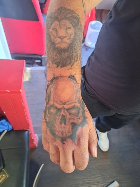 Black & Grey + Realism lion tattoo on Hand by Alejandro_Calderon on TattMe