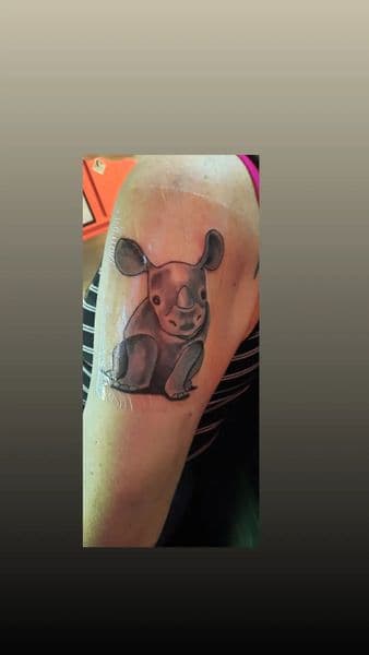 Black & Grey + Cartoon rhino tattoo on Upper Arm by Alejandro_Calderon on TattMe