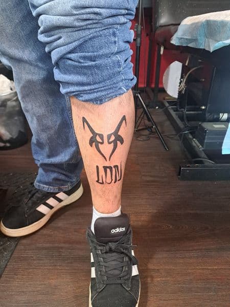 Black-work + Lettering symbol tattoo on Calf by Alejandro_Calderon on TattMe