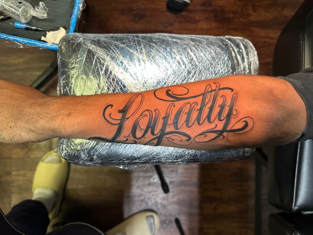Lettering + Script loyalty tattoo on Forearm by inkbyt0ny on TattMe
