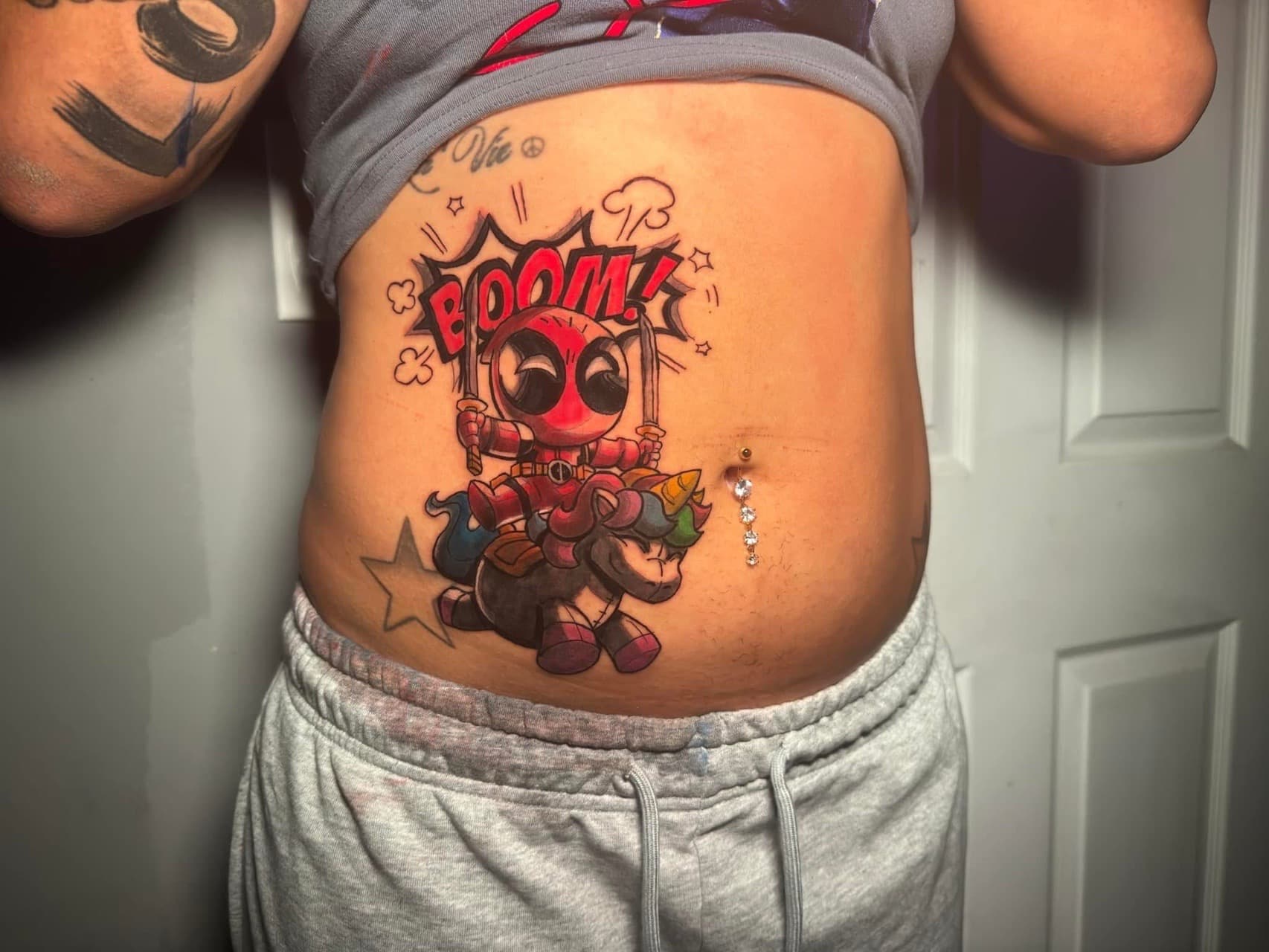 Cartoon + New School deadpool tattoo on Stomach by inkbyt0ny on TattMe