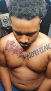 Lettering + Color phrase tattoo on Chest by Cakes_Ariana on TattMe