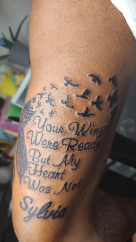 Script + Lettering feather tattoo on Upper Arm by Cakes_Ariana on TattMe