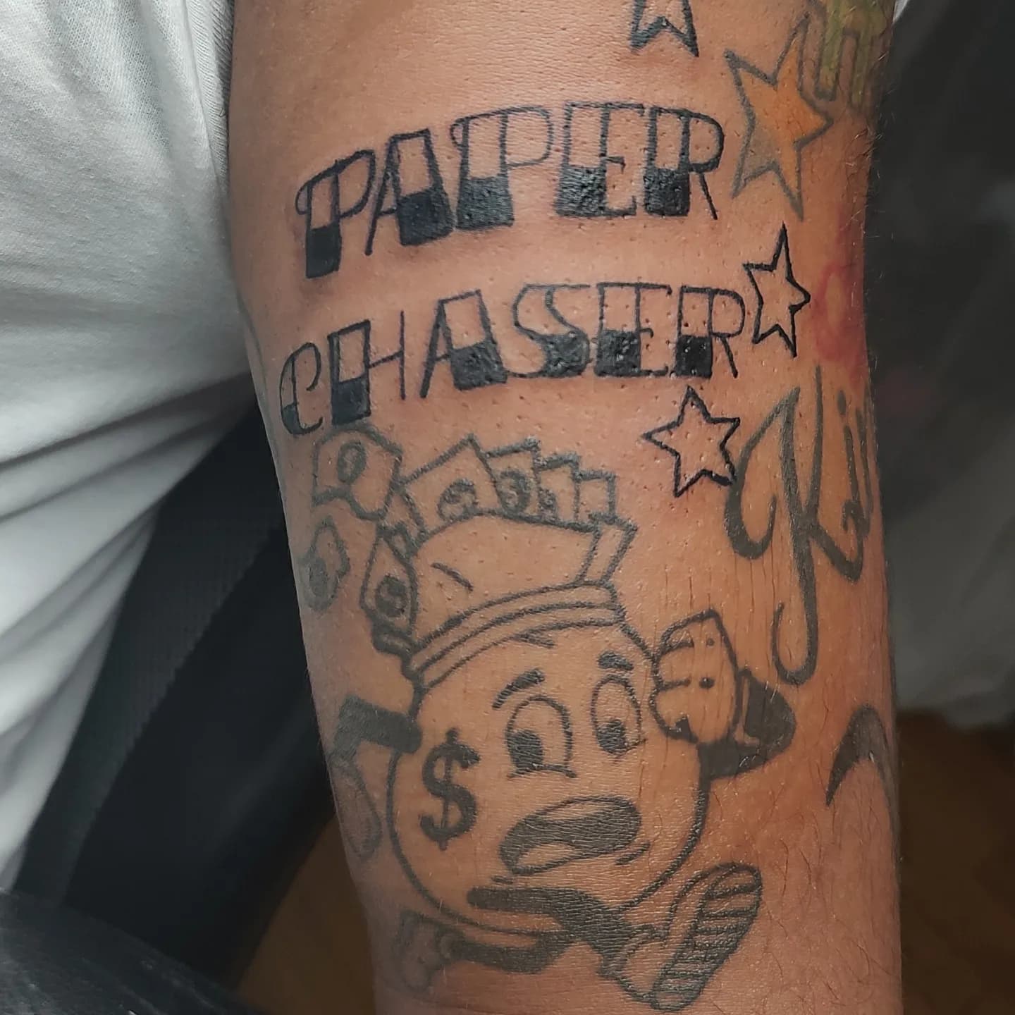 Lettering + Cartoon paper tattoo on Upper Arm by Cakes_Ariana on TattMe