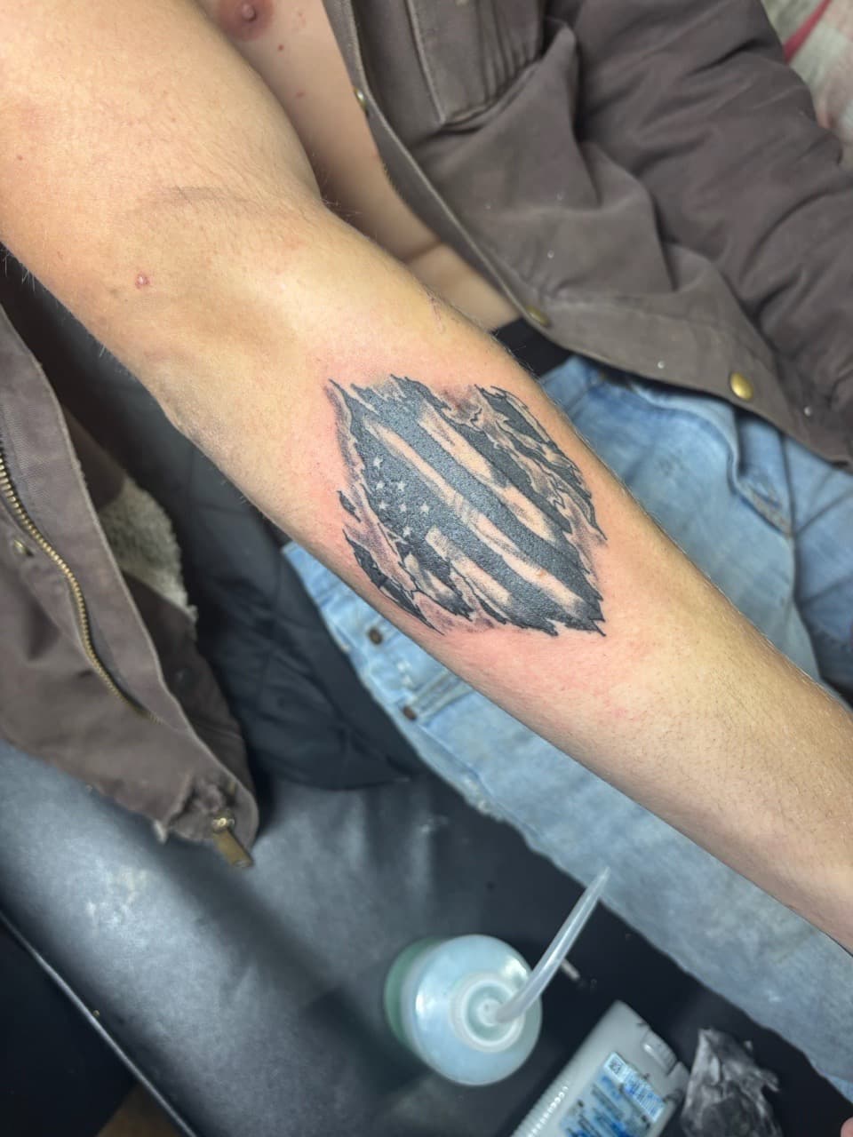 Black & Grey + Illustrative american flag tattoo on Forearm by TattedbyJayden on TattMe