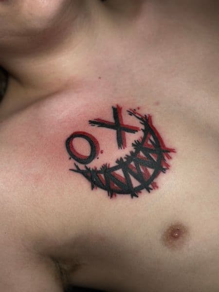 Trash Polka + Black-work smile tattoo on Chest by TattedbyJayden on TattMe