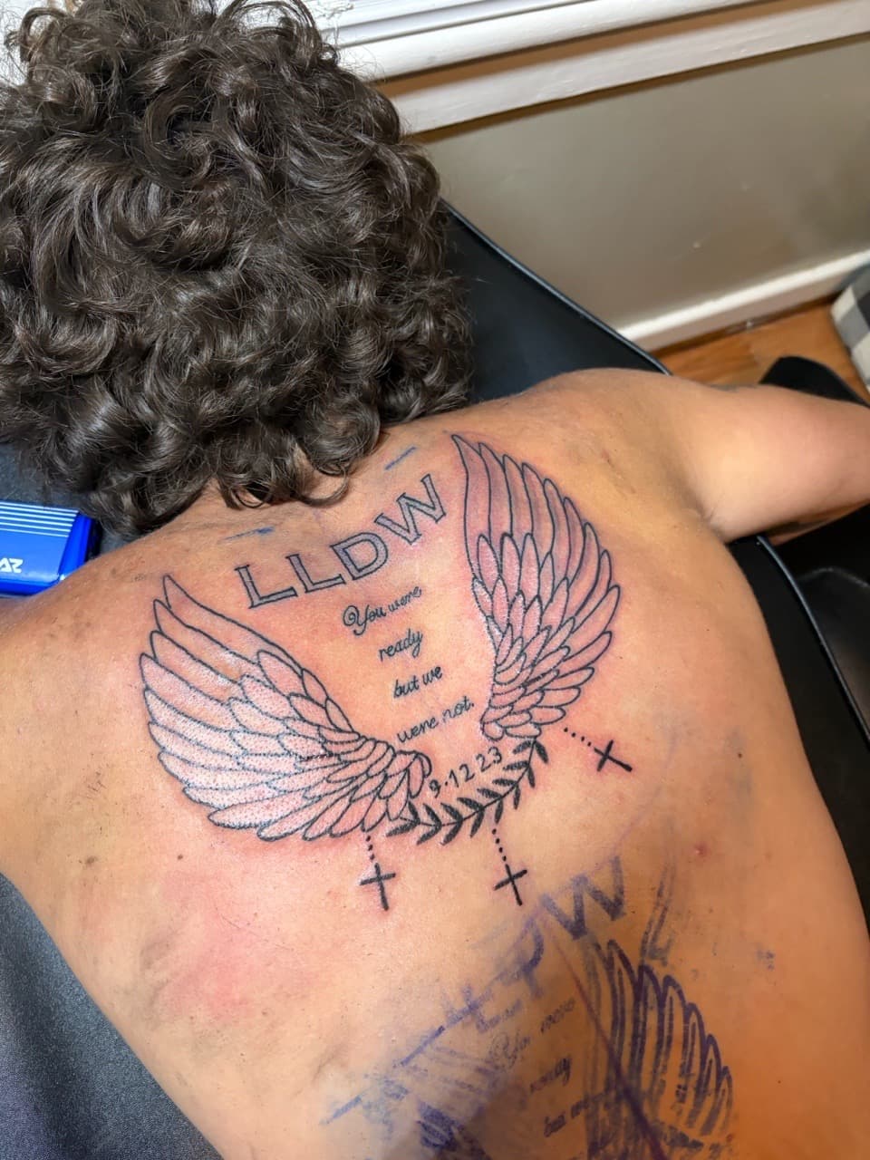 Lettering + Script wings tattoo on Upper Back by TattedbyJayden on TattMe