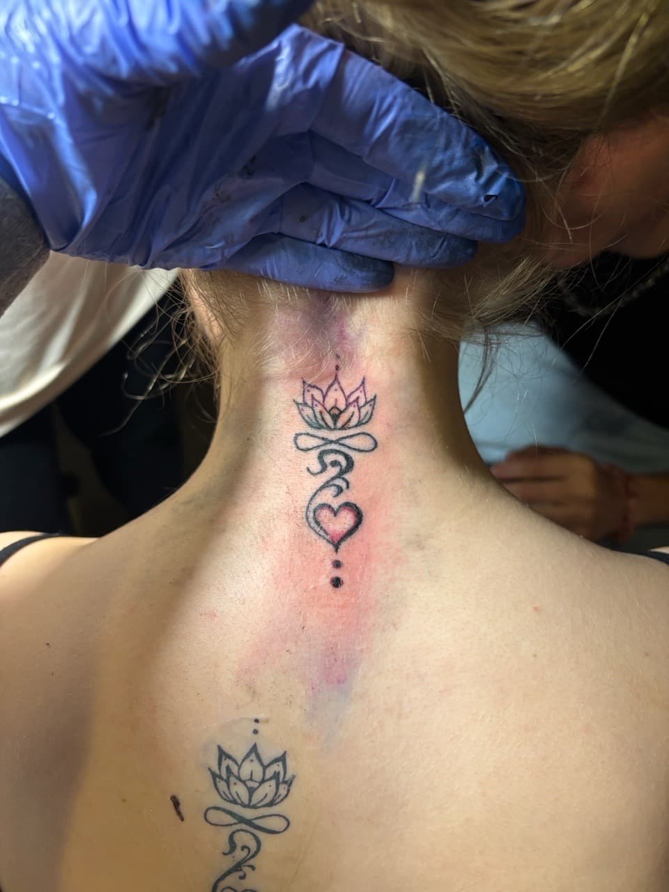 Fine Line + Black-work lotus tattoo on Neck (Back) by TattedbyJayden on TattMe