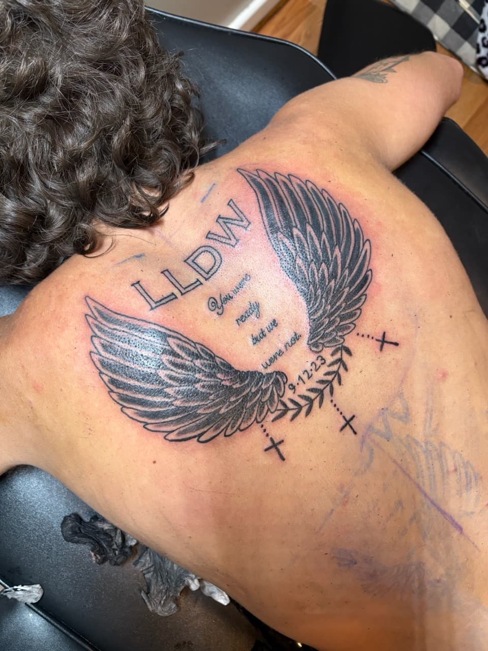 Black & Grey + Lettering wings tattoo on Upper Back by TattedbyJayden on TattMe
