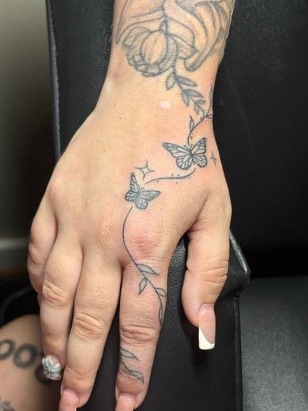 Fine Line + Black-work butterflies tattoo on Hand by TattedbyJayden on TattMe