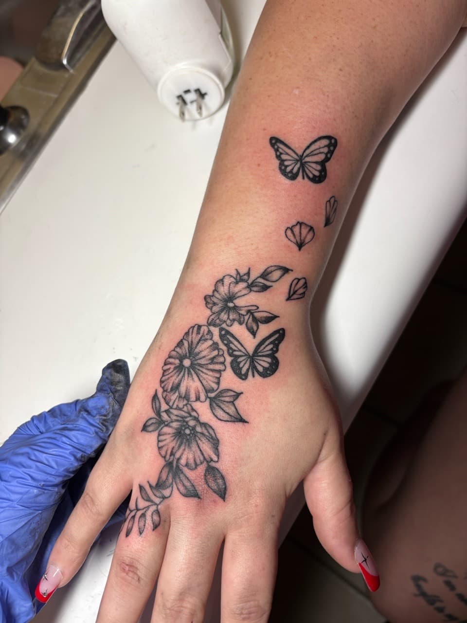 Fine Line + Floral butterflies tattoo on Hand by TattedbyJayden on TattMe