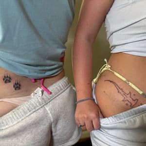 Fine Line + Black-work paw prints tattoo on Hip by TattedbyJayden on TattMe