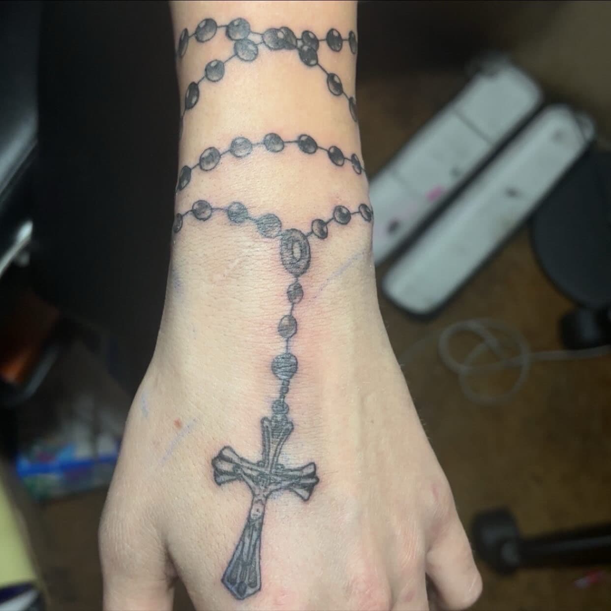 Black & Grey + Religious rosary tattoo on Hand by TattedbyJayden on TattMe