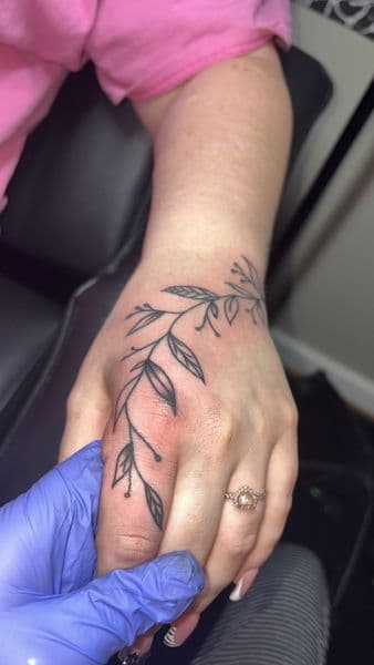 Fine Line + Floral leaves tattoo on Hand by TattedbyJayden on TattMe