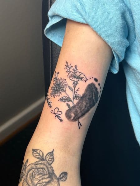 Fine Line + Black & Grey baby footprint tattoo on Forearm by TattedbyJayden on TattMe