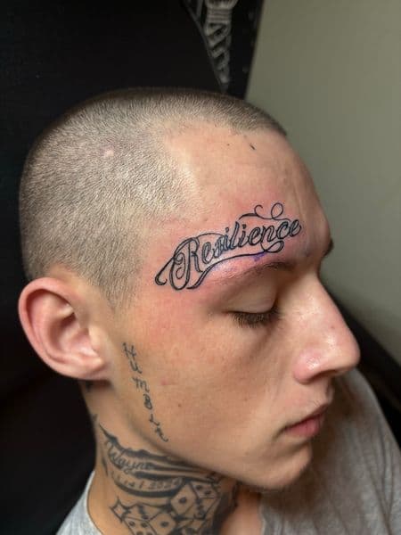 Lettering + Script resilience tattoo on Forehead by TattedbyJayden on TattMe