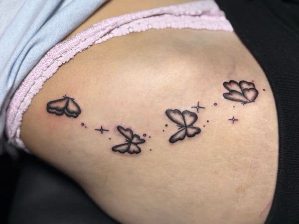 Fine Line + Black-work butterflies tattoo on Hip by TattedbyJayden on TattMe