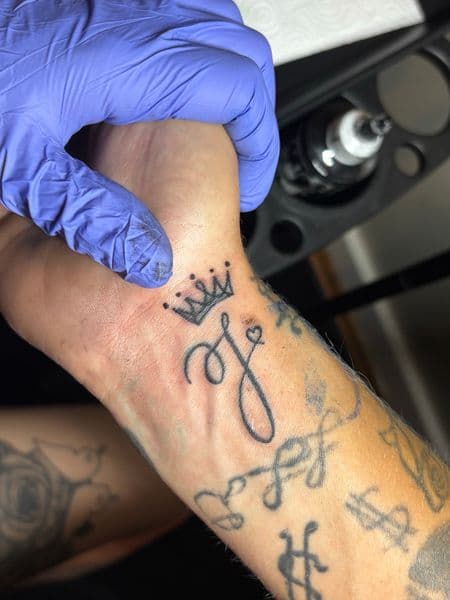 Script + Lettering crown tattoo on Wrist by TattedbyJayden on TattMe