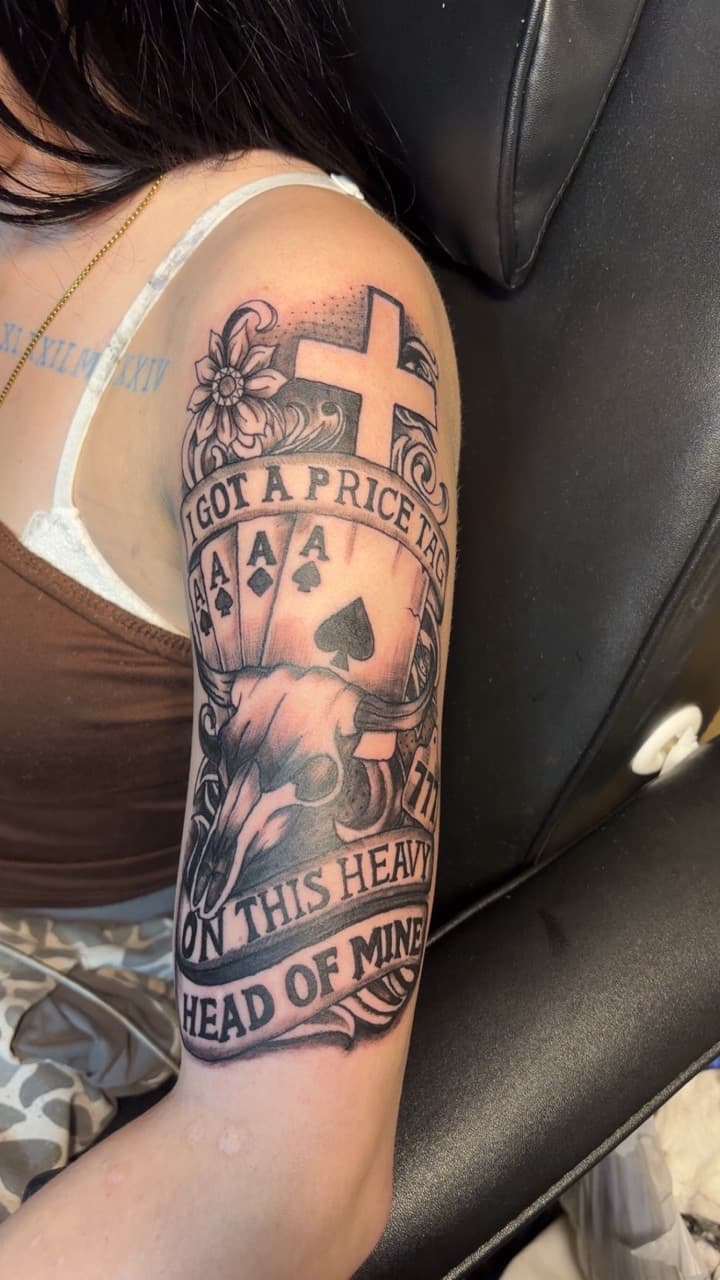 Black & Grey + Illustrative cross tattoo on Upper Arm by TattedbyJayden on TattMe
