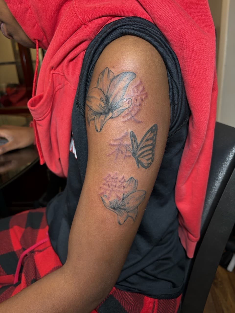 Floral + Black & Grey flowers tattoo on Upper Arm by TattedbyJayden on TattMe
