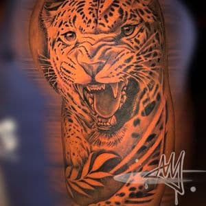 Black & Grey + Animals jaguar jungle tattoo on Upper Arm by Ayem.ink on TattMe