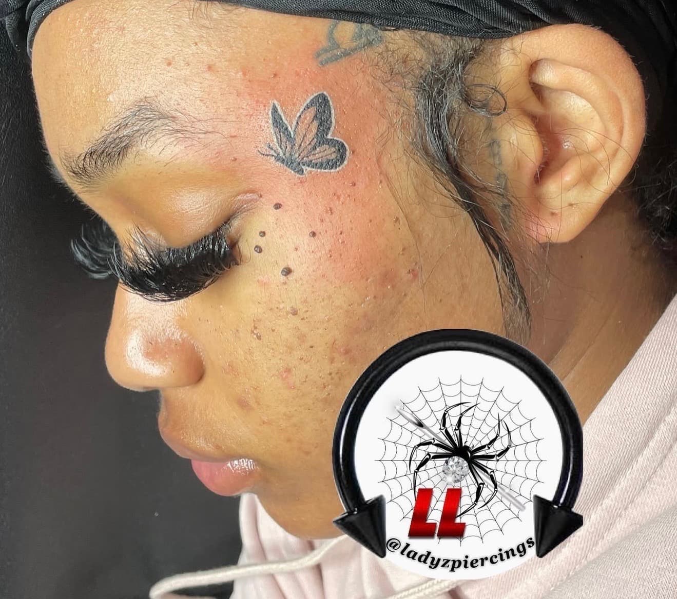 Fine Line + Black-work butterfly tattoo on Face by Ladyzpiercings on TattMe