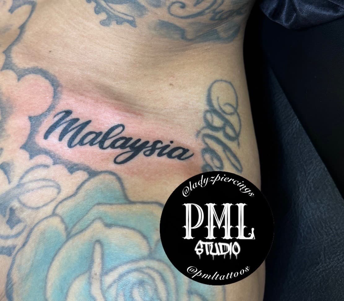 Lettering + Script malaysia tattoo on Chest by Ladyzpiercings on TattMe