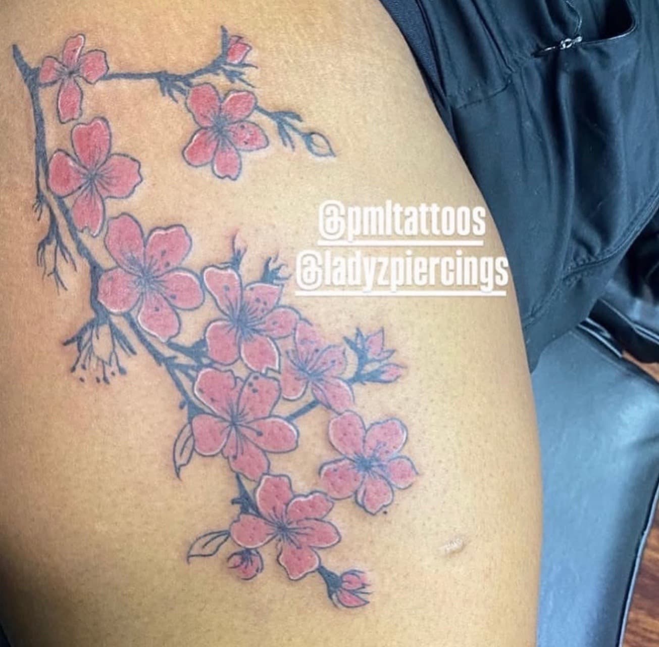 Floral + Color cherry blossoms tattoo on Thigh by Ladyzpiercings on TattMe